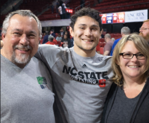 Howie and Beth Barber with Michael Macchiavello after an NC State wrestling meet during his college career.